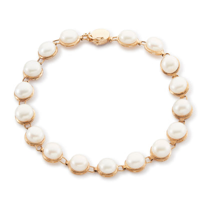 Lovely 9ct yellow gold bracelet set with seventeen lustrous button pearls.