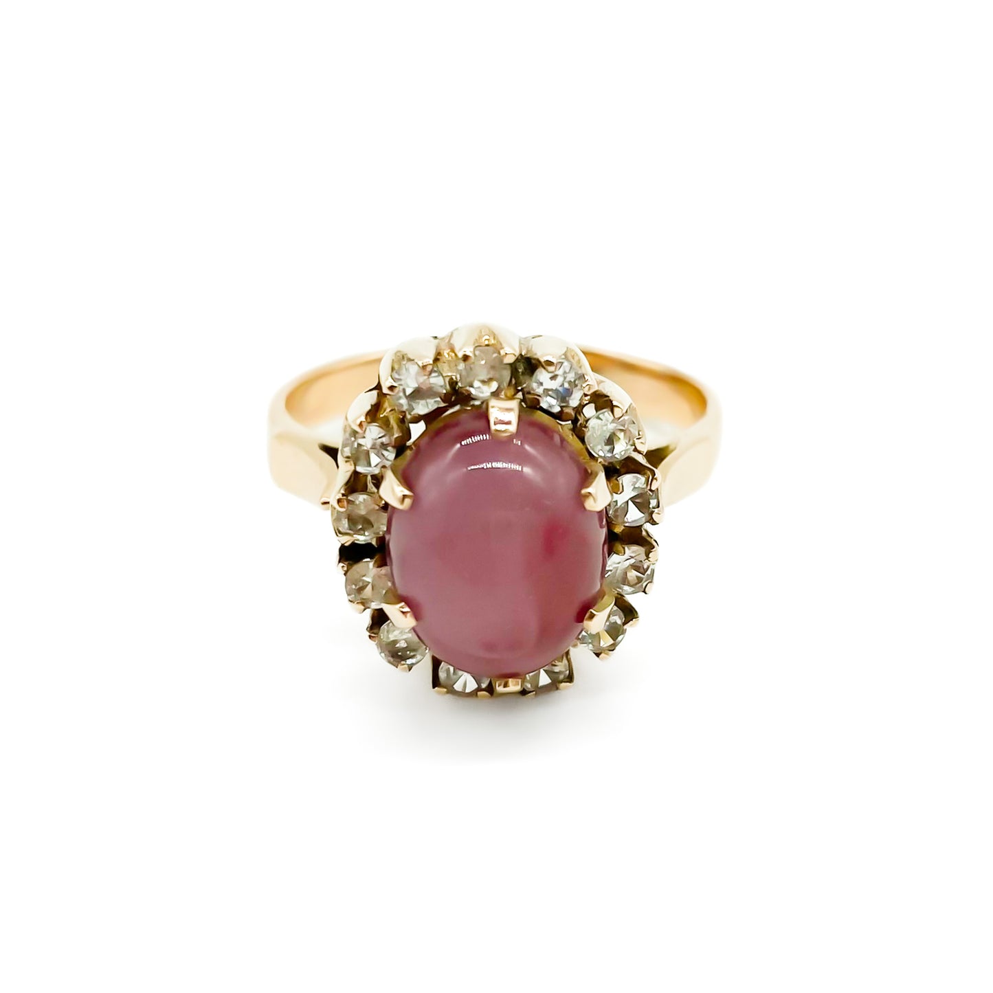 Lovely 9ct gold vintage ring set with an oval dusty pink quartz cabochon, surrounded by thirteen white faceted spinel stones.