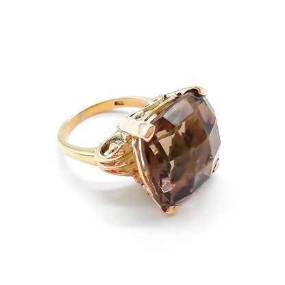 Classic 9ct yellow gold ring set with a beautifully faceted cushion-cut smoky quartz.