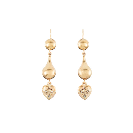 Stunning vintage 9ct yellow gold drop earrings, each with a dangling heart that is set with three seed pearls.