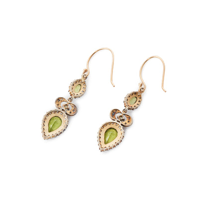 Exquisite vintage 9ct gold and silver drop earrings, each set with two bright green faceted peridots surrounded by seed pearls and one small peridot with three small mine cut diamonds on each side.