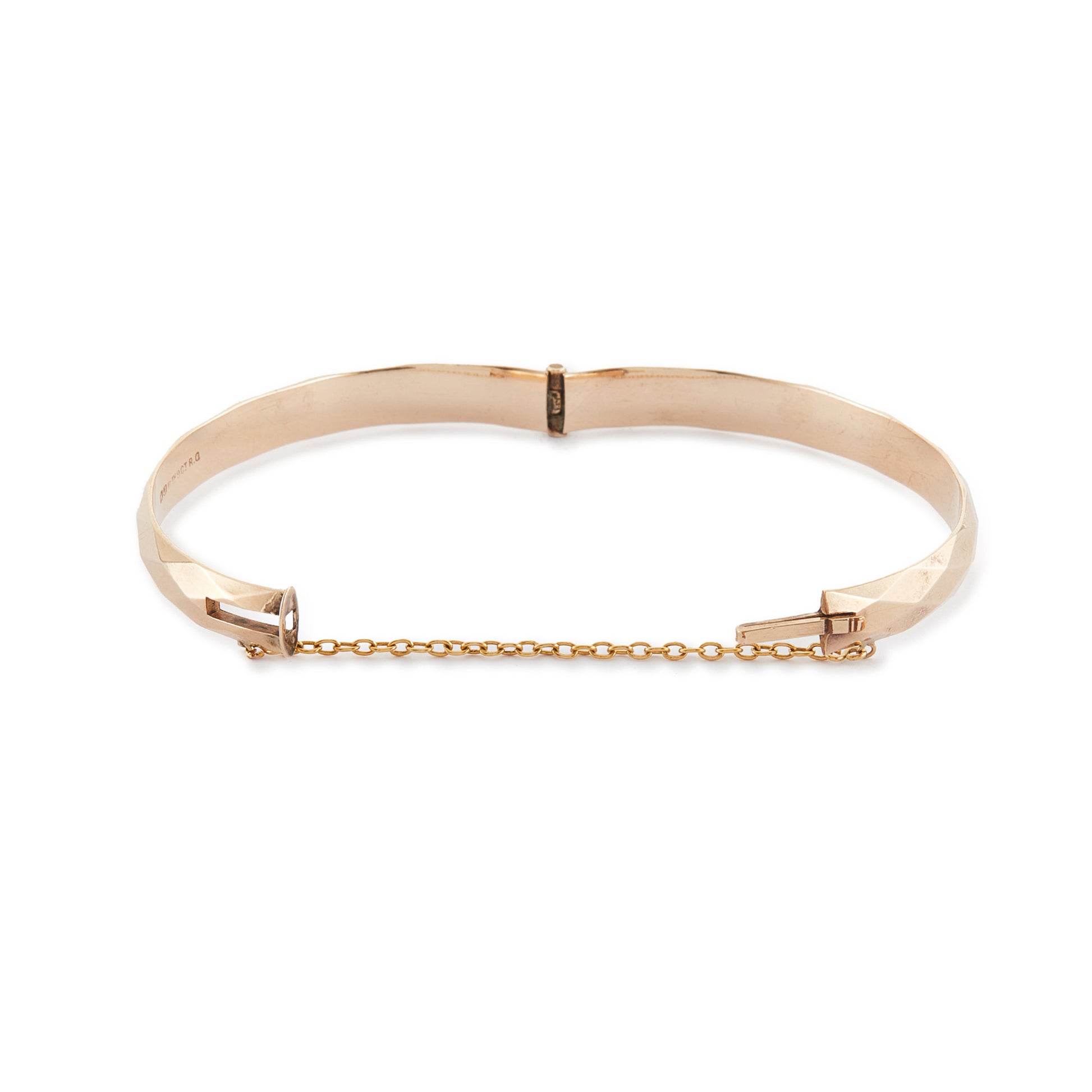 Classic 9ct rose gold (⅕) rolled gold bangle with harlequin design. Safety chain attached.