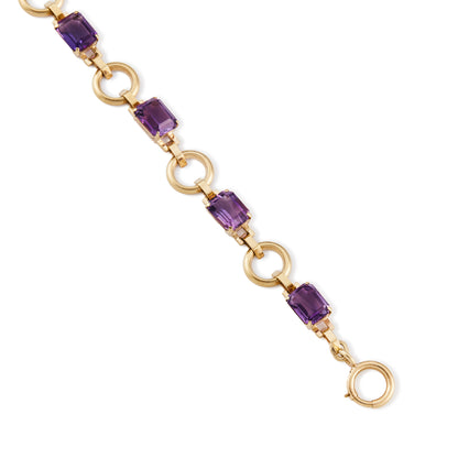 Classic 9ct rose gold bracelet set with six faceted rectangular deep purple amethysts and a bolt ring clasp.&nbsp;