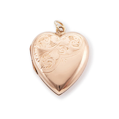 Lovely 9ct rose gold back and front locket with engraving on one side. The locket opens to take two photographs.
