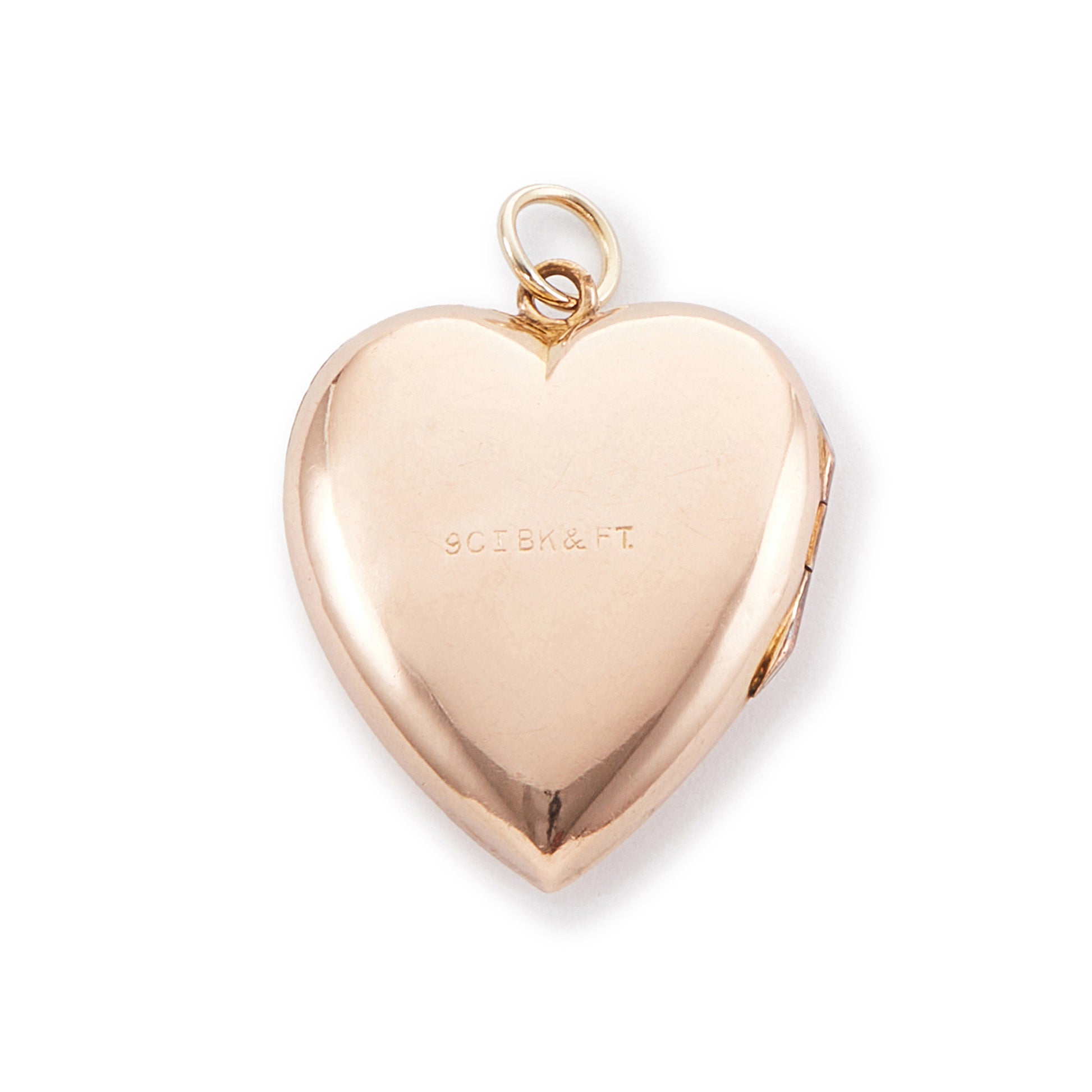 Lovely 9ct rose gold back and front locket with engraving on one side. The locket opens to take two photographs.
