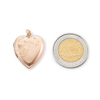 Lovely 9ct rose gold back and front locket with engraving on one side. The locket opens to take two photographs.