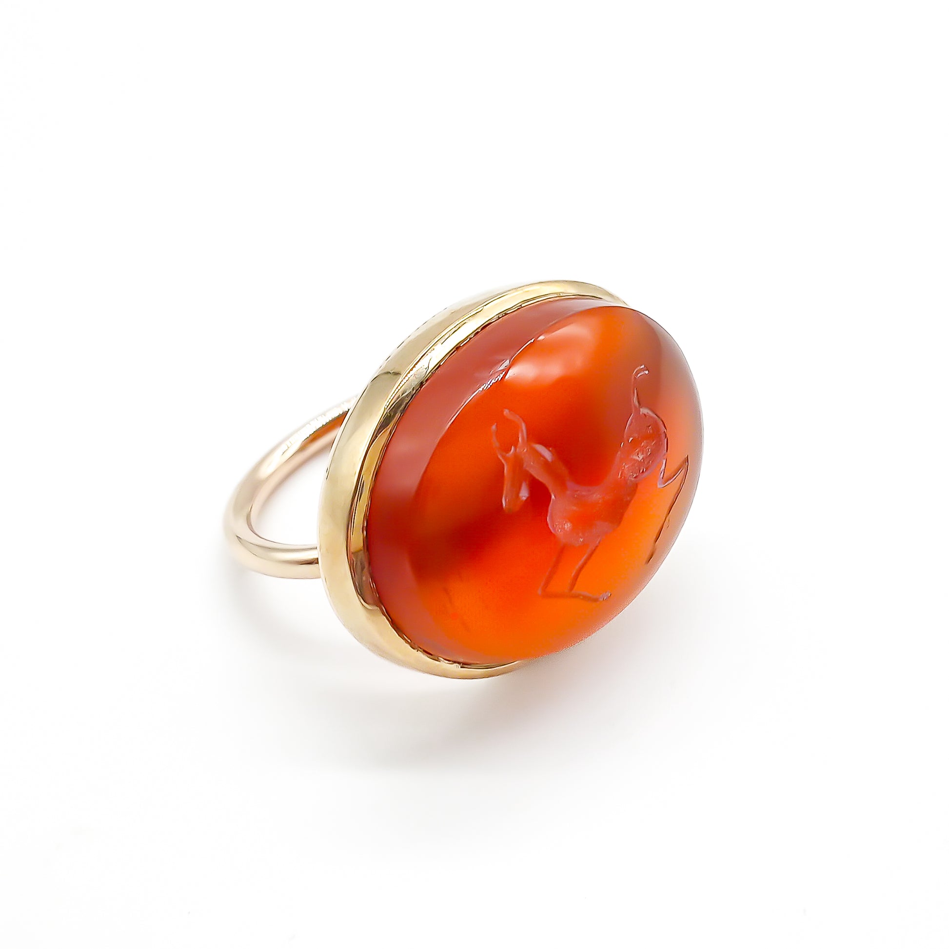 Unusual 9ct rose gold ring set with an antique oval carnelian intaglio depicting a stag.