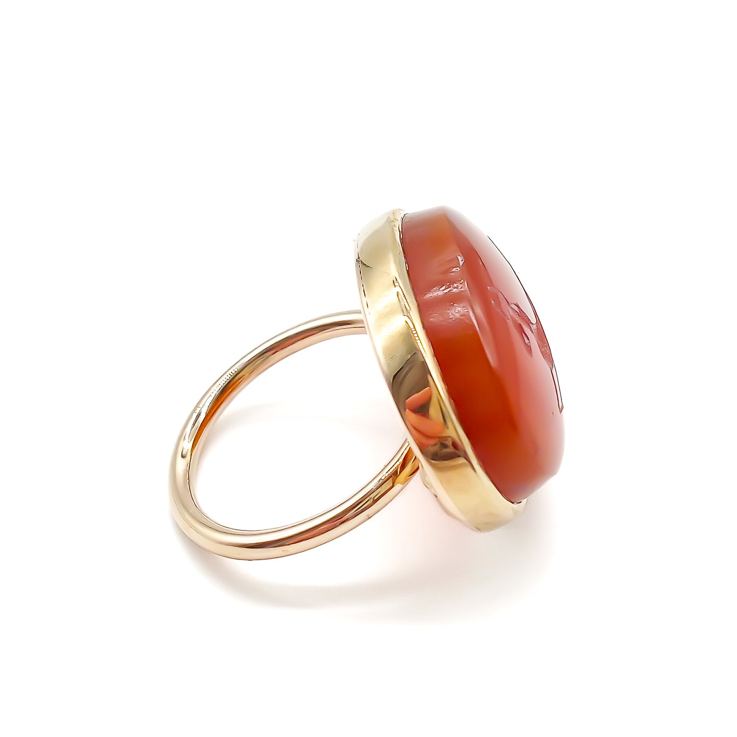 Unusual 9ct rose gold ring set with an antique oval carnelian intaglio depicting a stag.