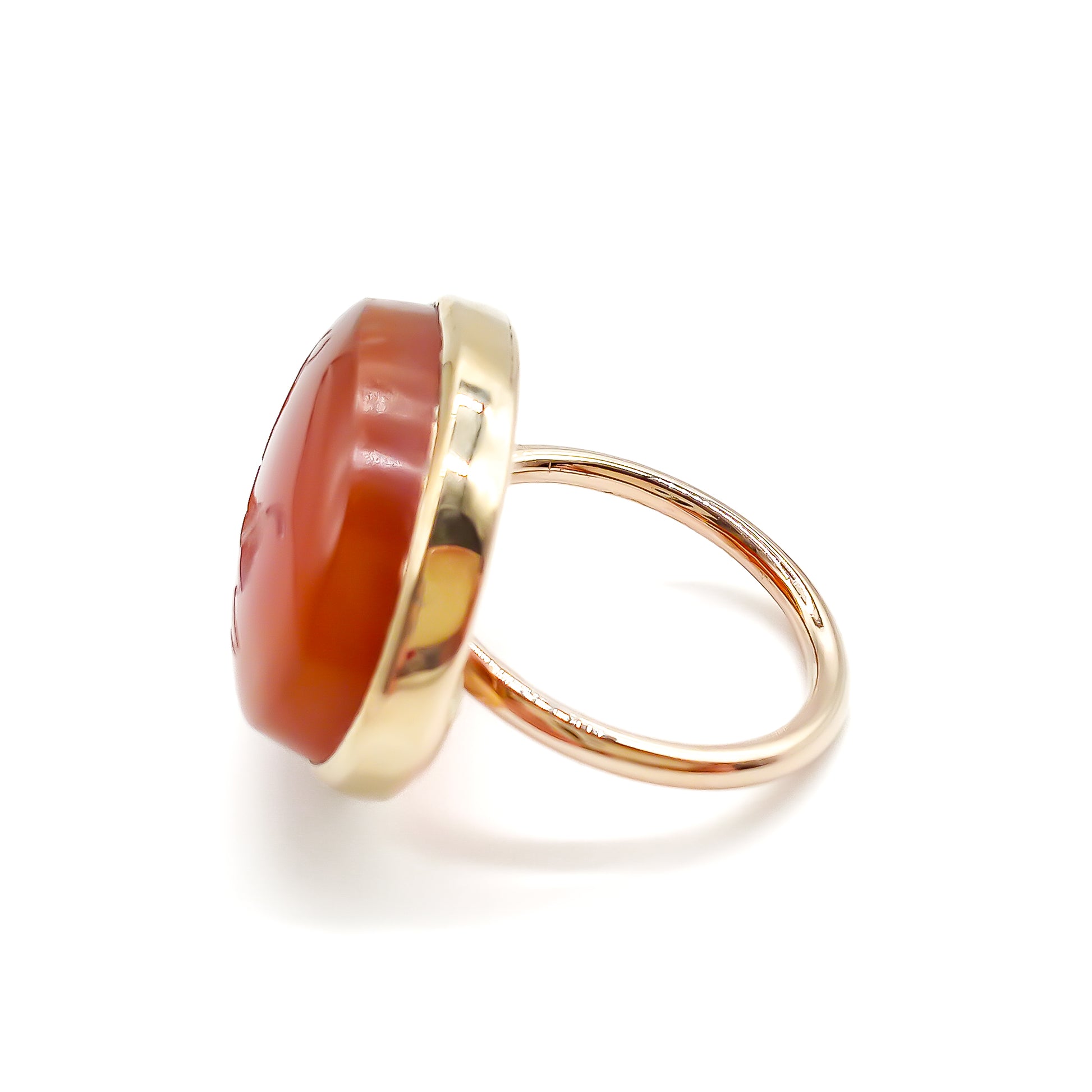 Unusual 9ct rose gold ring set with an antique oval carnelian intaglio depicting a stag.