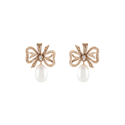 Lovely 9ct rose gold bow shaped earrings, each set with a small diamond and a lustrous pearl drop.