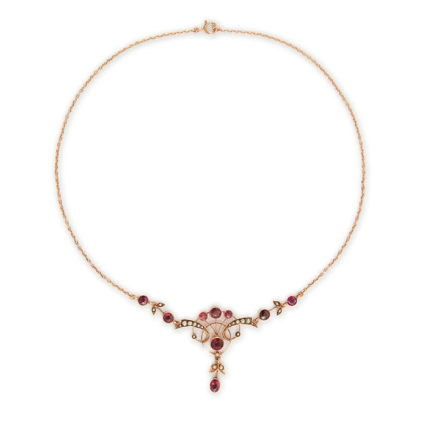 Exquisite Edwardian 9ct rose gold necklace set with nine rhodolite garnets and eighteen seed pearls.