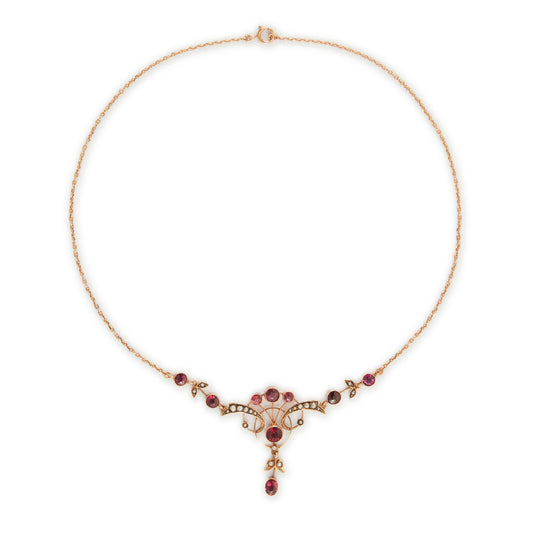 Exquisite Edwardian 9ct rose gold necklace set with nine rhodolite garnets and eighteen seed pearls.