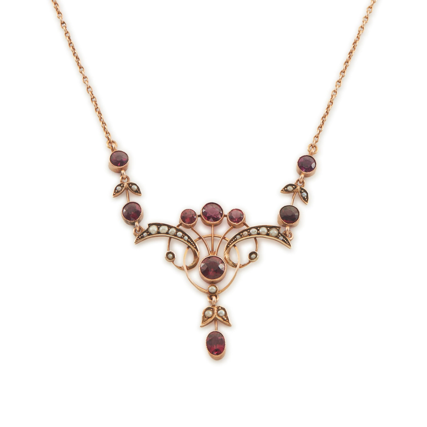 Exquisite Edwardian 9ct rose gold necklace set with nine rhodolite garnets and eighteen seed pearls.