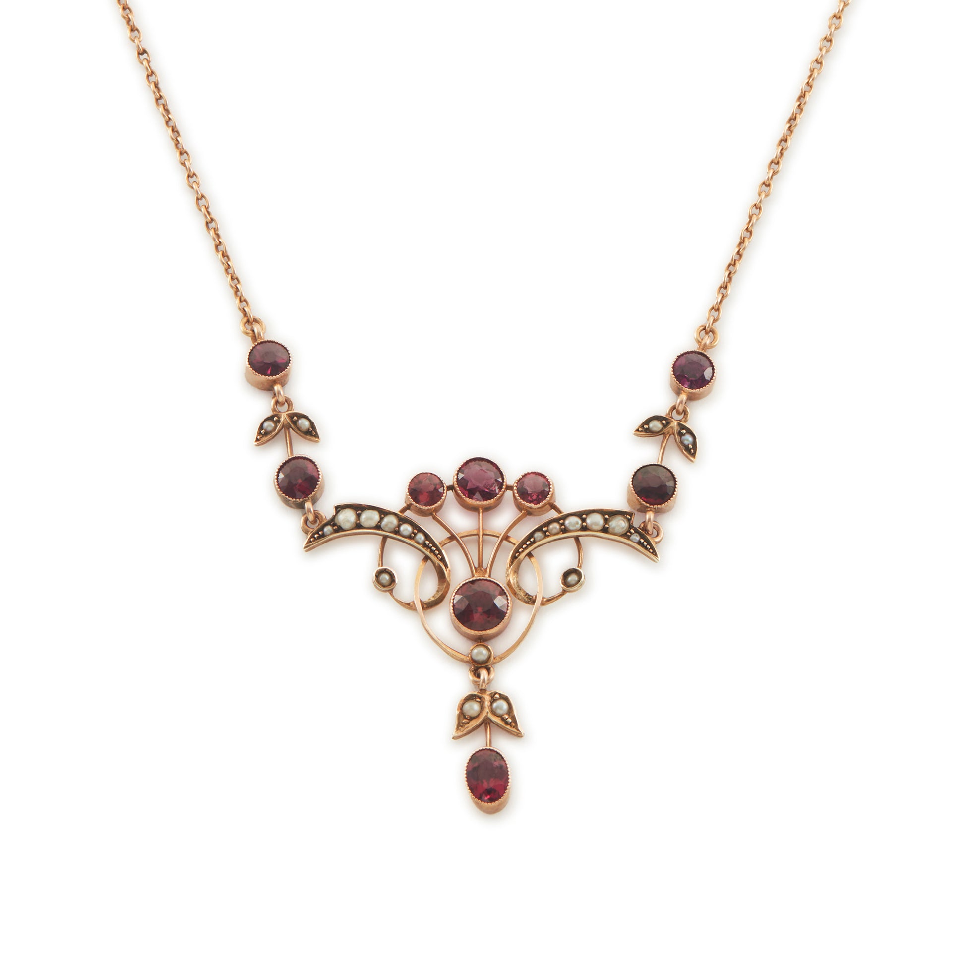 Exquisite Edwardian 9ct rose gold necklace set with nine rhodolite garnets and eighteen seed pearls.