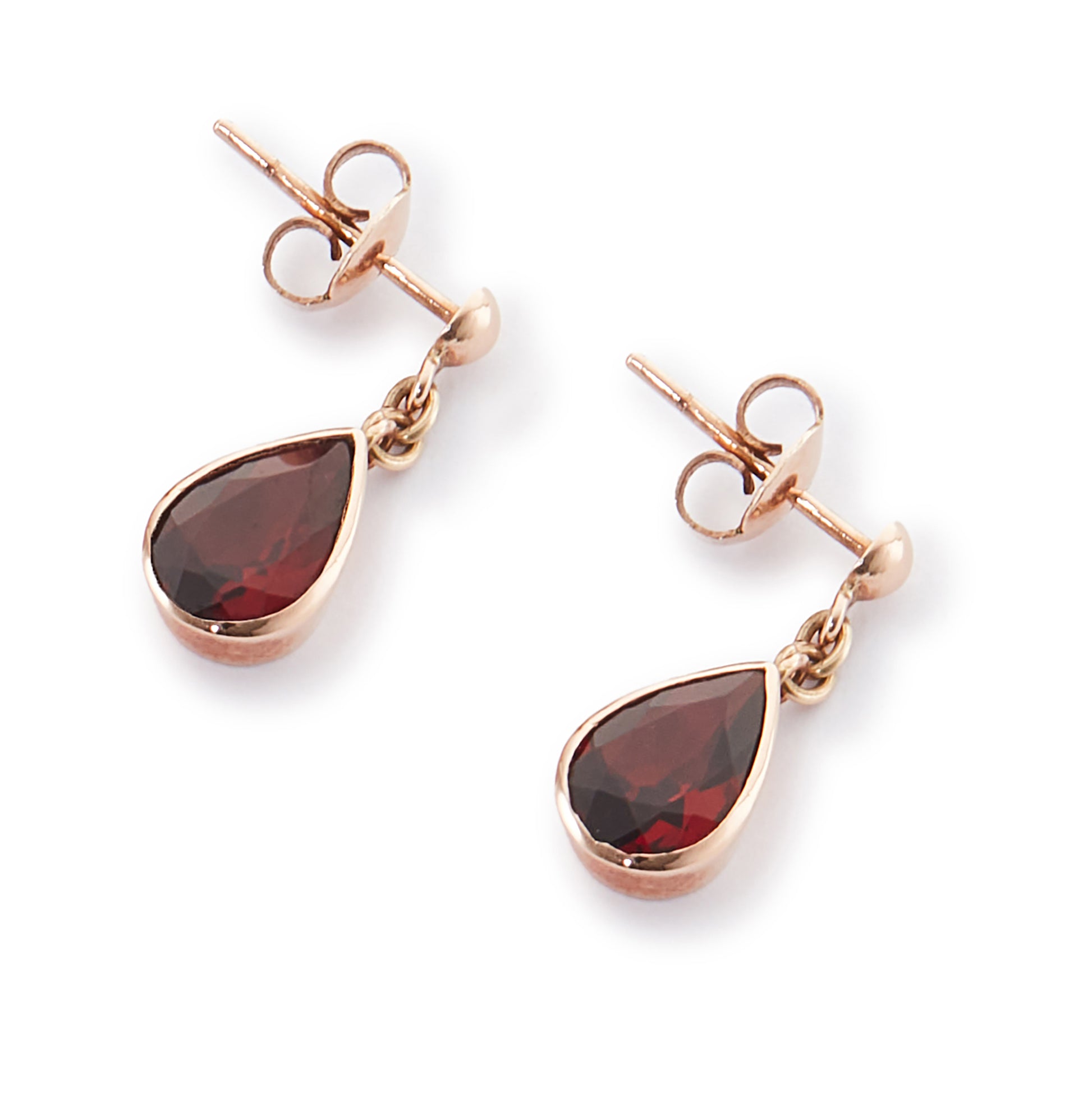 Vintage 9ct rose gold earrings, each set with a beautifully faceted teardrop-shaped garnet with a deep red hue.