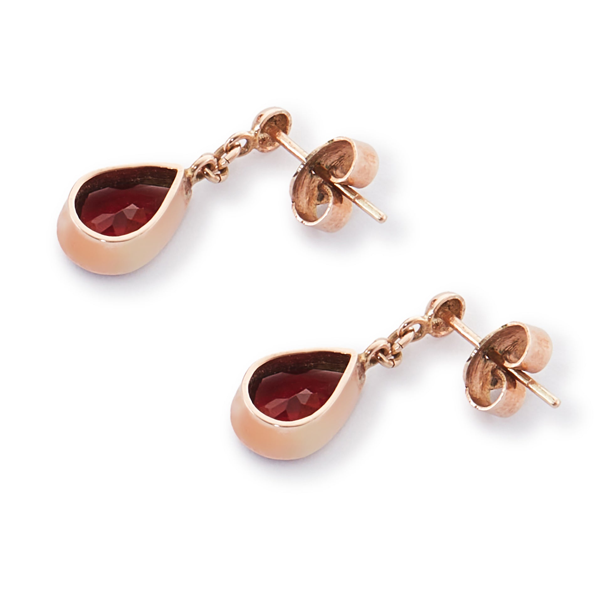 Vintage 9ct rose gold earrings, each set with a beautifully faceted teardrop-shaped garnet with a deep red hue.