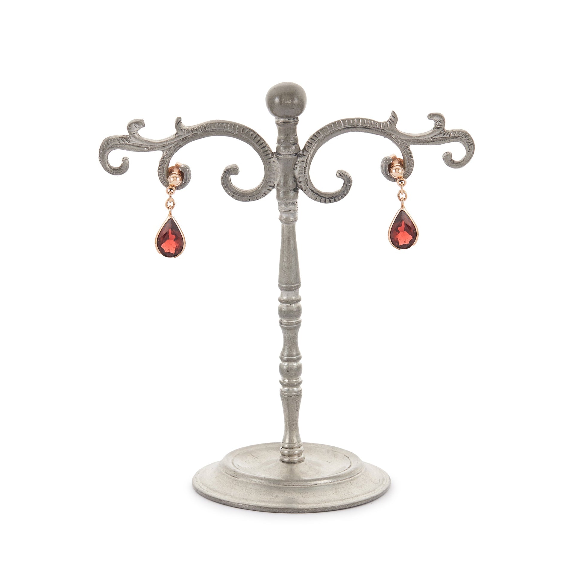 Vintage 9ct rose gold earrings, each set with a beautifully faceted teardrop-shaped garnet with a deep red hue.