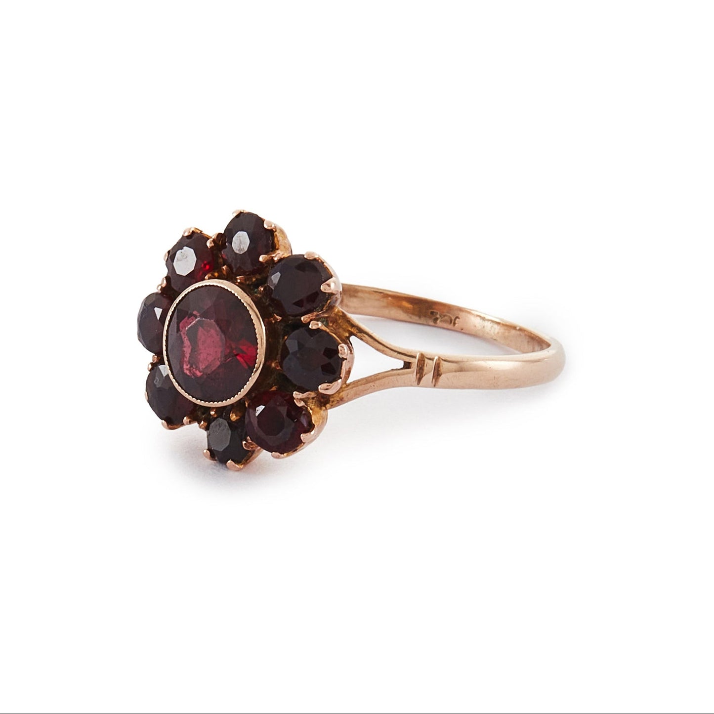 Lovely 9ct rose gold ring set with nine beautifully faceted Bohemian garnets in the shape of a flower.