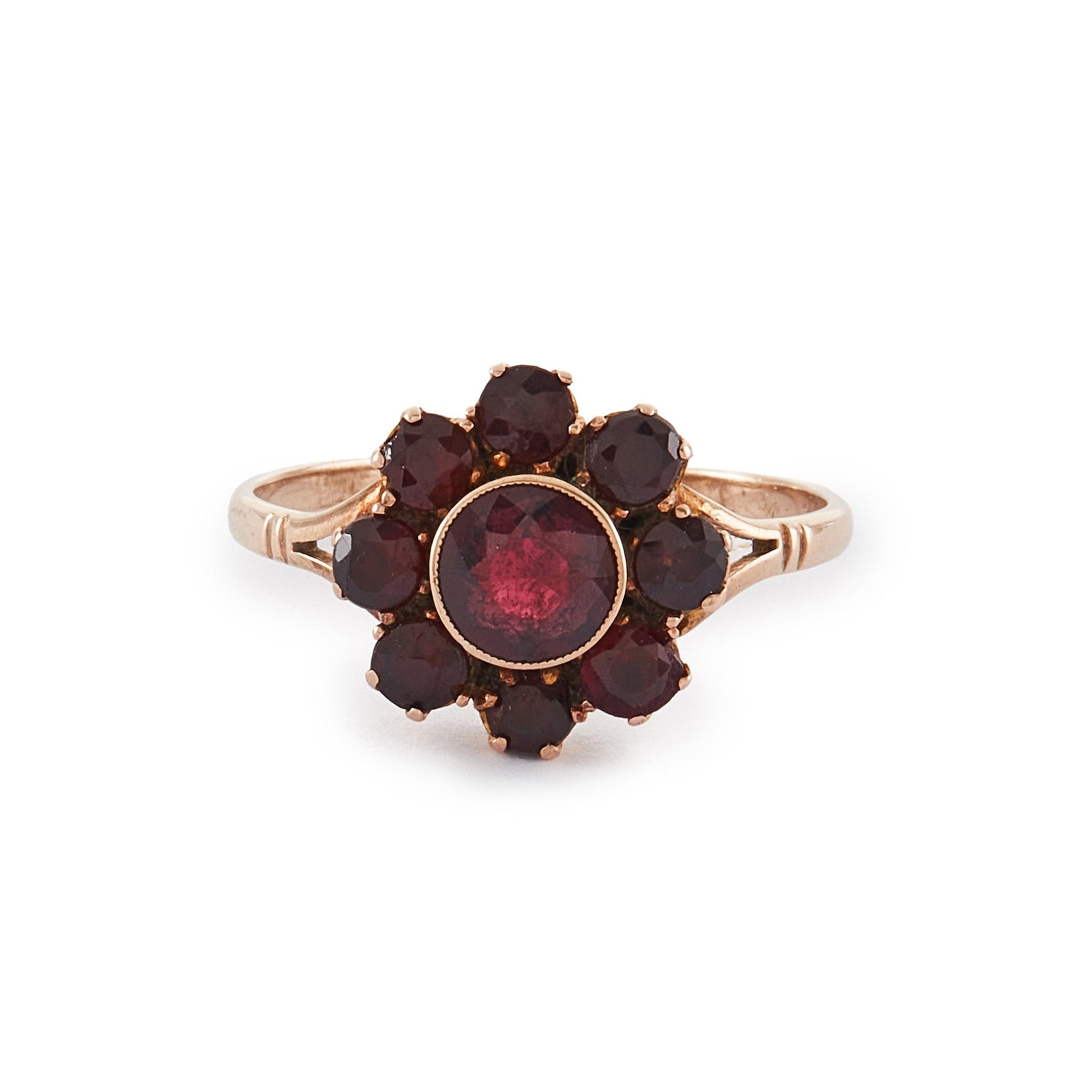 Lovely 9ct rose gold ring set with nine beautifully faceted Bohemian garnets in the shape of a flower.

