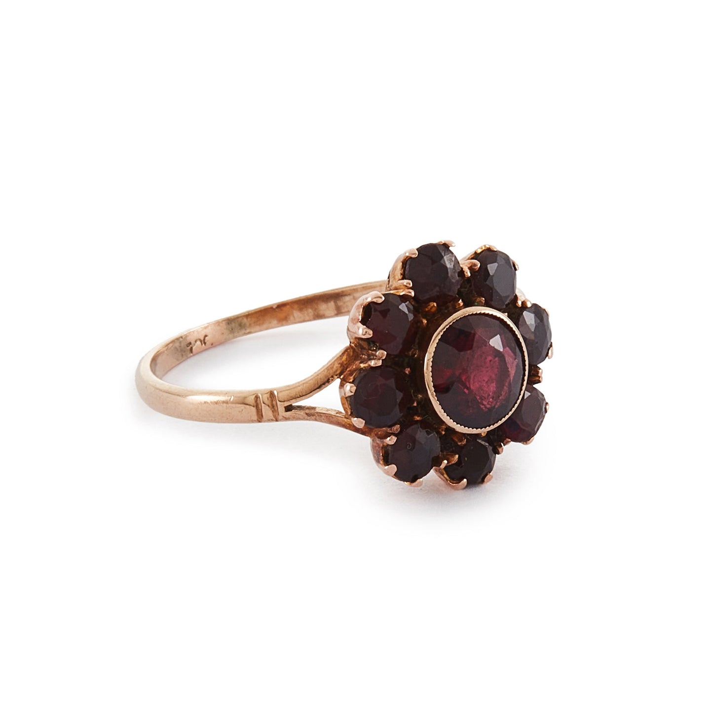 Lovely 9ct rose gold ring set with nine beautifully faceted Bohemian garnets in the shape of a flower.