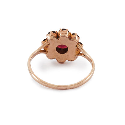 Lovely 9ct rose gold ring set with nine beautifully faceted Bohemian garnets in the shape of a flower.