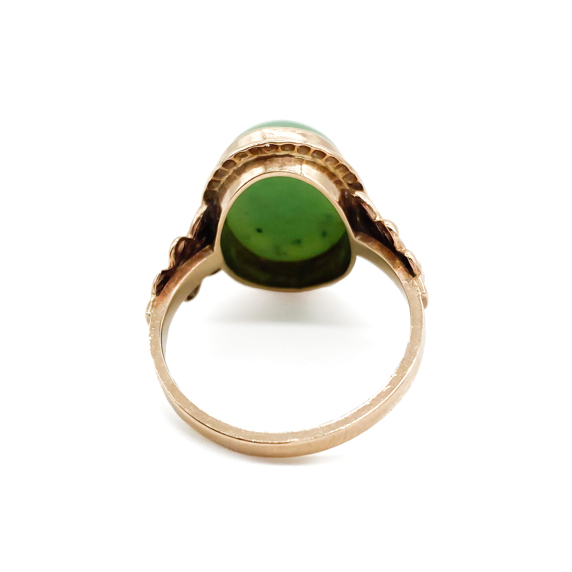 Charming 9ct rose gold ring set with a lovely green oval cabochon jade stone.