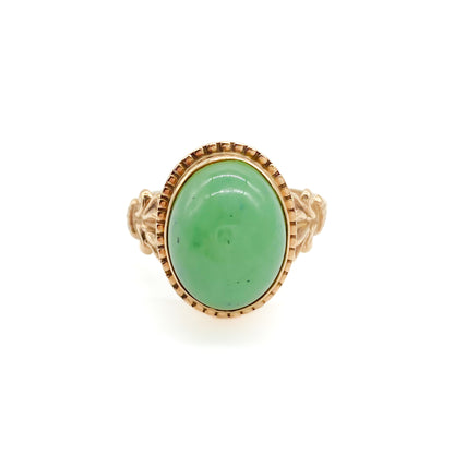 Charming 9ct rose gold ring set with a lovely green oval cabochon jade stone.