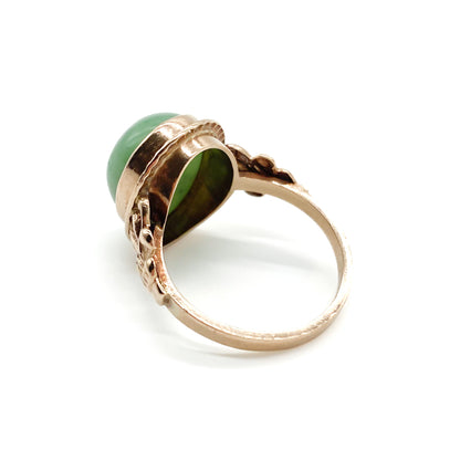 Charming 9ct rose gold ring set with a lovely green oval cabochon jade stone.