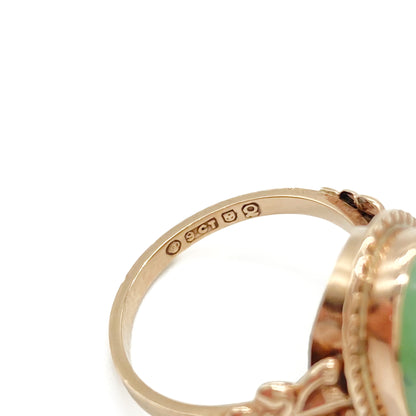 Charming 9ct rose gold ring set with a lovely green oval cabochon jade stone.