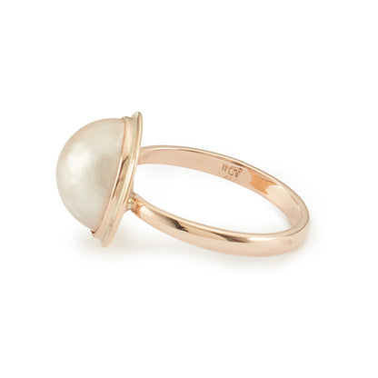 Classic 9ct rose gold ring with a lustrous mabe pearl in a tube setting.