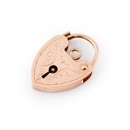 9ct rose gold padlock with ornate engraving on the front.