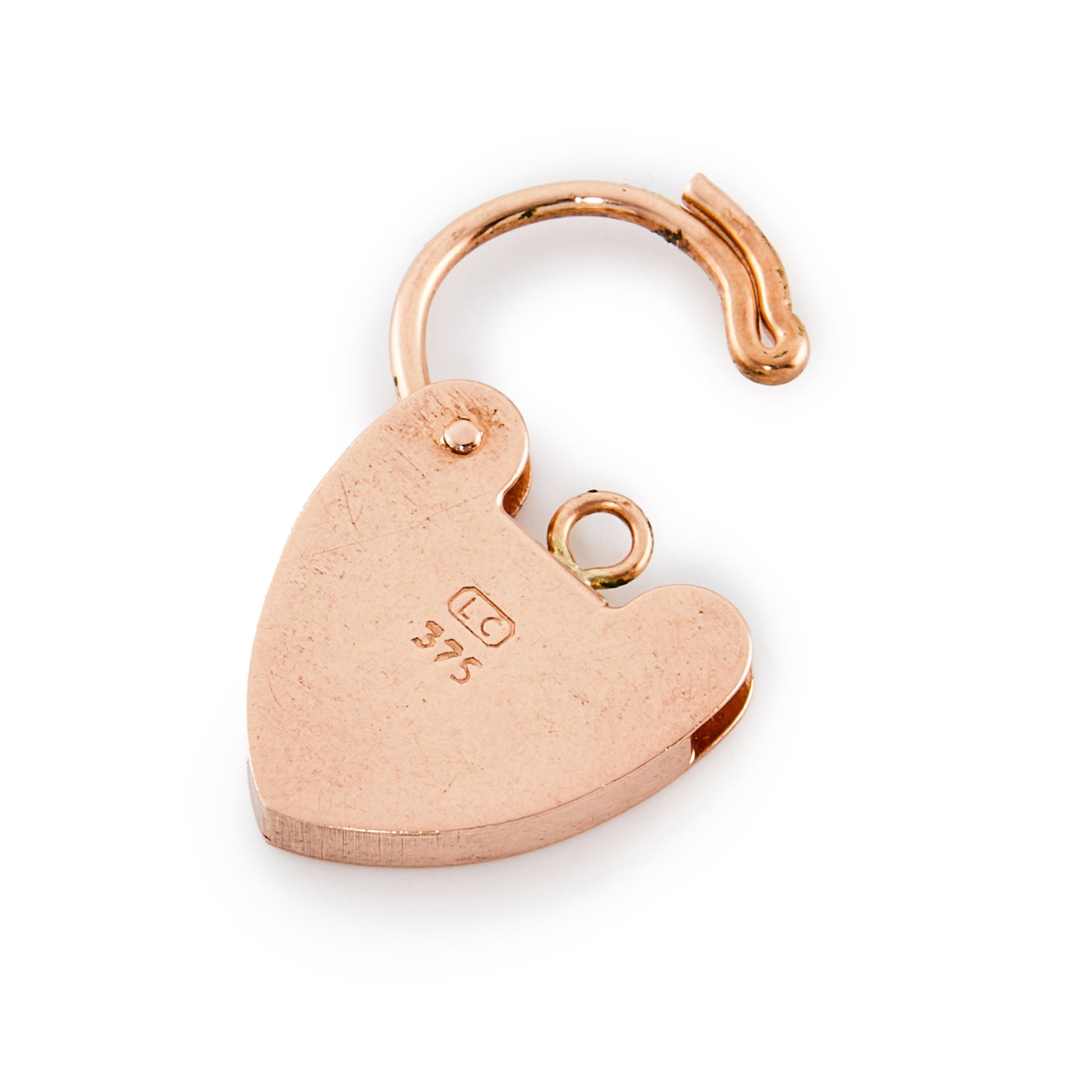 9ct rose gold padlock with ornate engraving on the front.