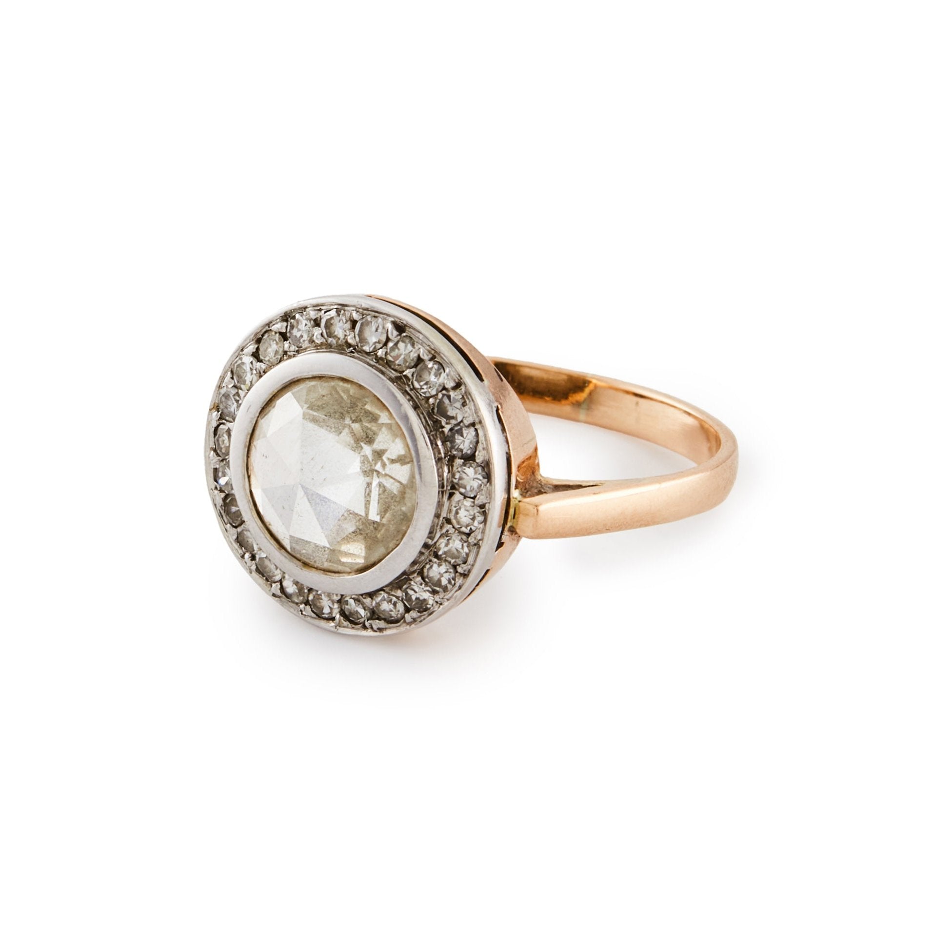 Magnificent 9ct rose gold ring with a 1.3ct rose-cut diamond in a platinum halo setting comprising 24 x 0.02ct diamonds.
