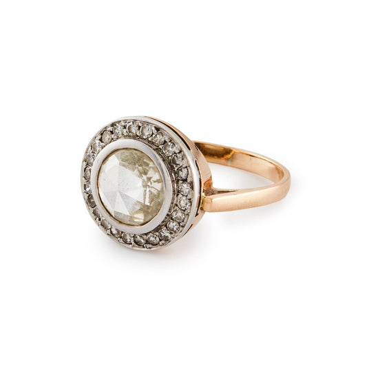 Magnificent 9ct rose gold ring with a 1.3ct rose-cut diamond in a platinum halo setting comprising 24 x 0.02ct diamonds.
