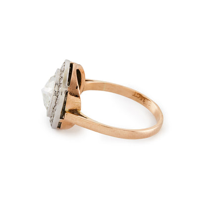 Magnificent 9ct rose gold ring with a 1.3ct rose-cut diamond in an 18ct white gold halo setting comprising 24 x 0.02ct diamonds.