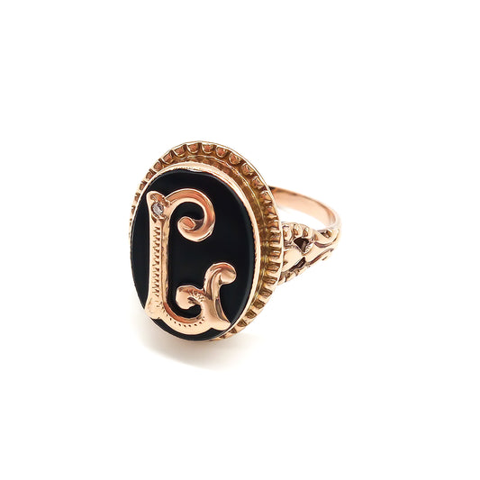 Classic 9ct rose gold and onyx signet ring with a fancy script letter “L”, containing a small diamond.