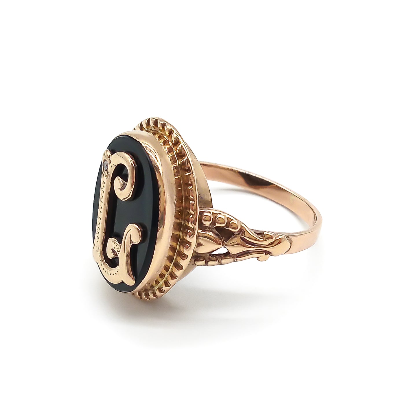 Classic 9ct rose gold and onyx signet ring with a fancy script letter “L”, containing a small diamond.