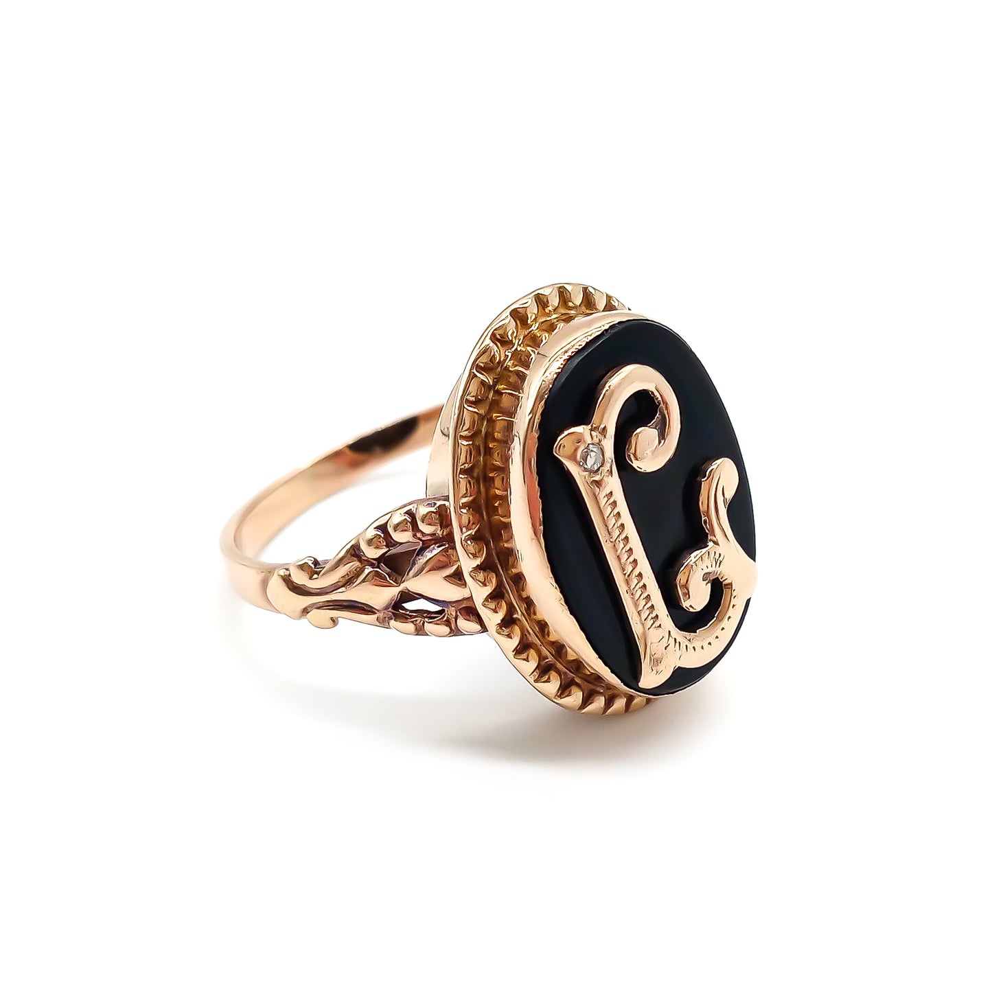 Classic 9ct rose gold and onyx signet ring with a fancy script letter “L”, containing a small diamond.