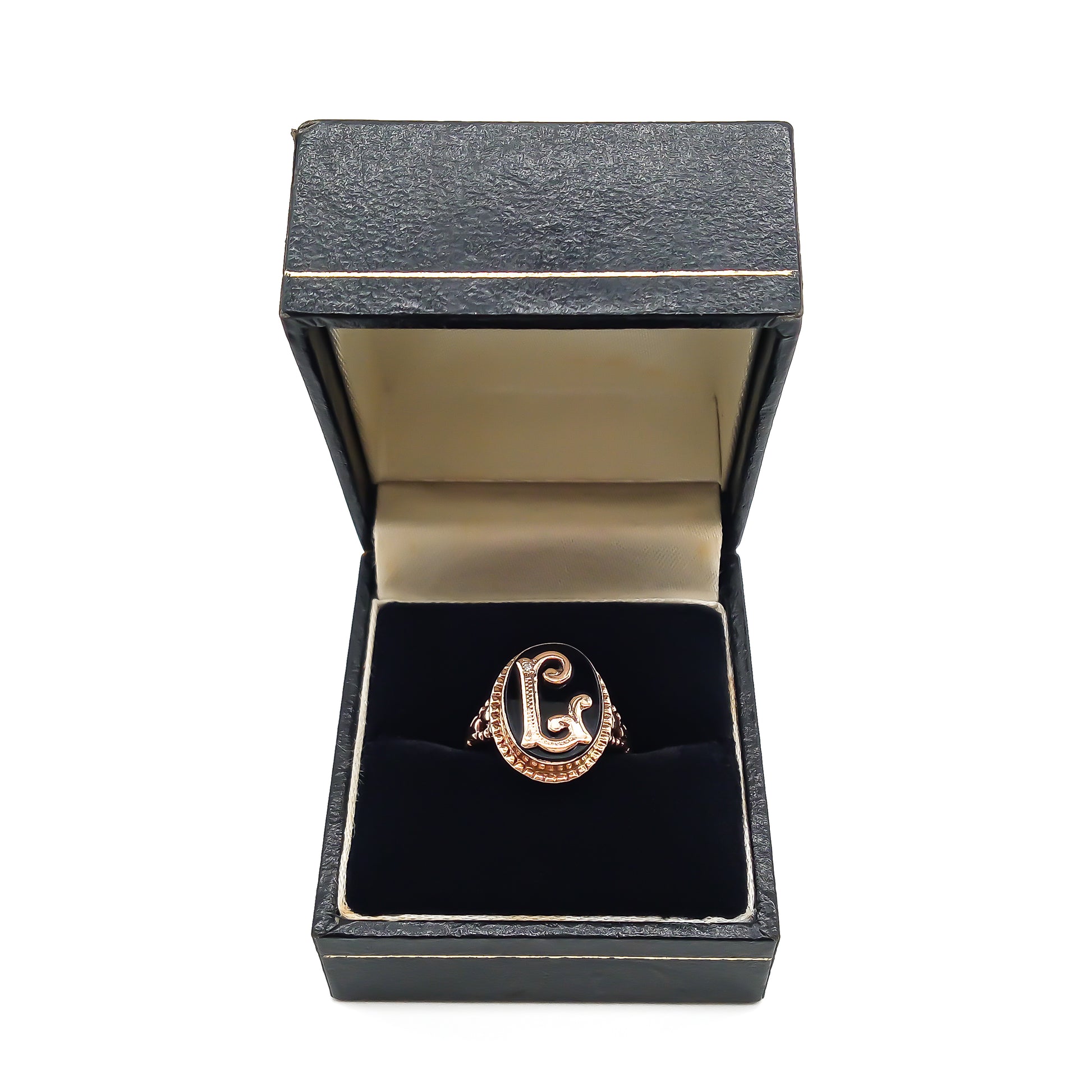 Classic 9ct rose gold and onyx signet ring with a fancy script letter “L”, containing a small diamond.