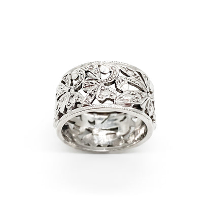 Ornate 9ct white gold band with intricate leaf design.