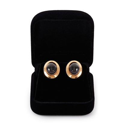 Classic pair of 9ct gold stud earrings, each set with a lovely deep red cabochon garnet.
