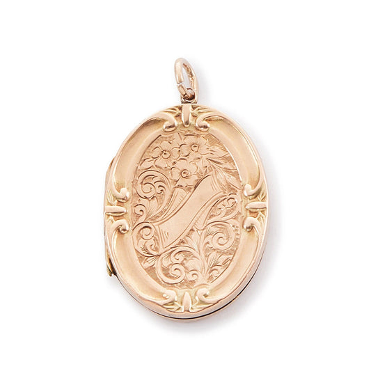 Beautiful 9ct rose gold oval shaped back and front locket with ornate engraving. The locket opens to take two photographs. 
Stamped: A&C 9ct BK & FT