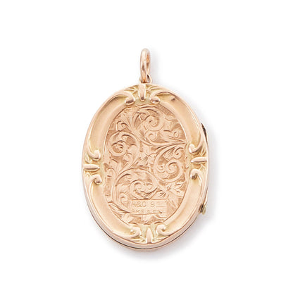 Beautiful 9ct rose gold oval shaped back and front locket with ornate engraving. The locket opens to take two photographs. 
Stamped: A&C 9ct BK & FT