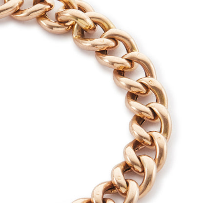 Classic Victorian 9ct rose gold curb link bracelet with a padlock and safety chain.