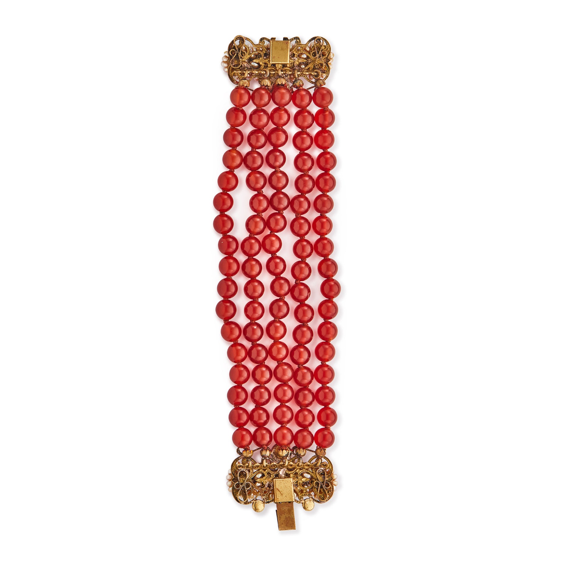 Spectacular antique carnelian five-strand bracelet with a very ornate brass, carnelian and seed pearl clasp. A real statement piece!