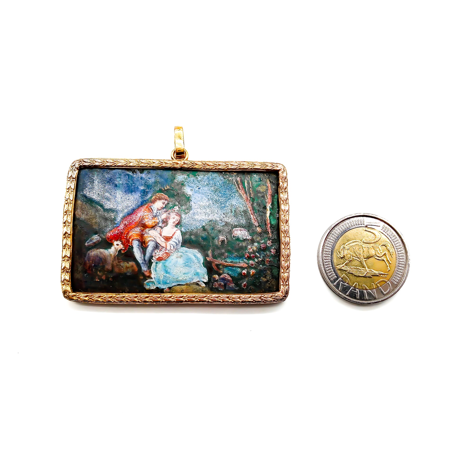 Beautiful enamelled pastoral scene in a gold plated setting.