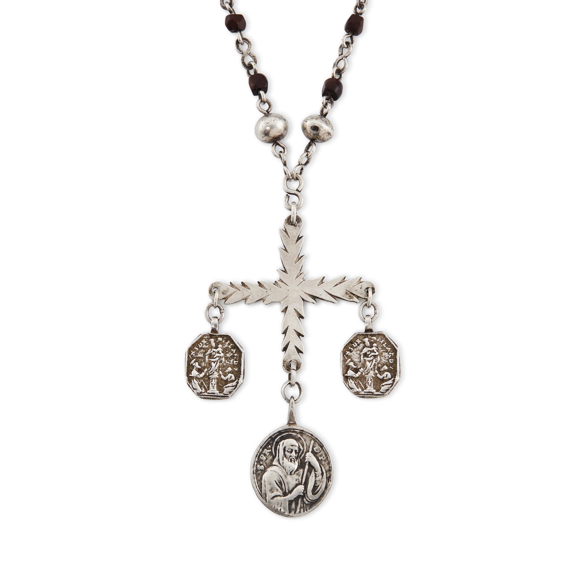 Stunning antique silver rosary with a cross and three dangling saint discs. The cross hangs on a 102cm oxidised silver ornate link chain, interspersed with natural red-brown stones and six silver bobbles.