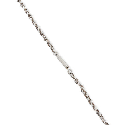 Stunning antique silver rosary with a cross and three dangling saint discs. The cross hangs on a 102cm oxidised silver ornate link chain, interspersed with natural red-brown stones and six silver bobbles.