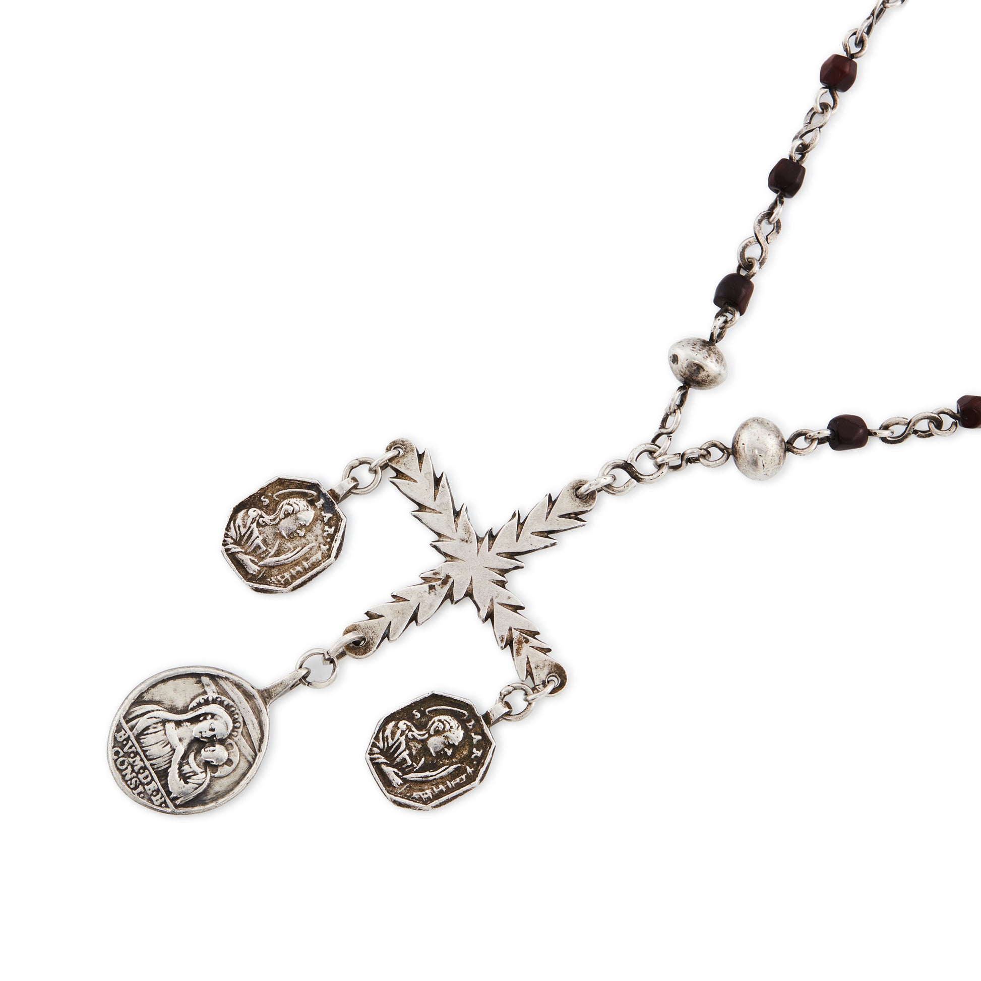 Stunning antique silver rosary with a cross and three dangling saint discs. The cross hangs on a 102cm oxidised silver ornate link chain, interspersed with natural red-brown stones and six silver bobbles.