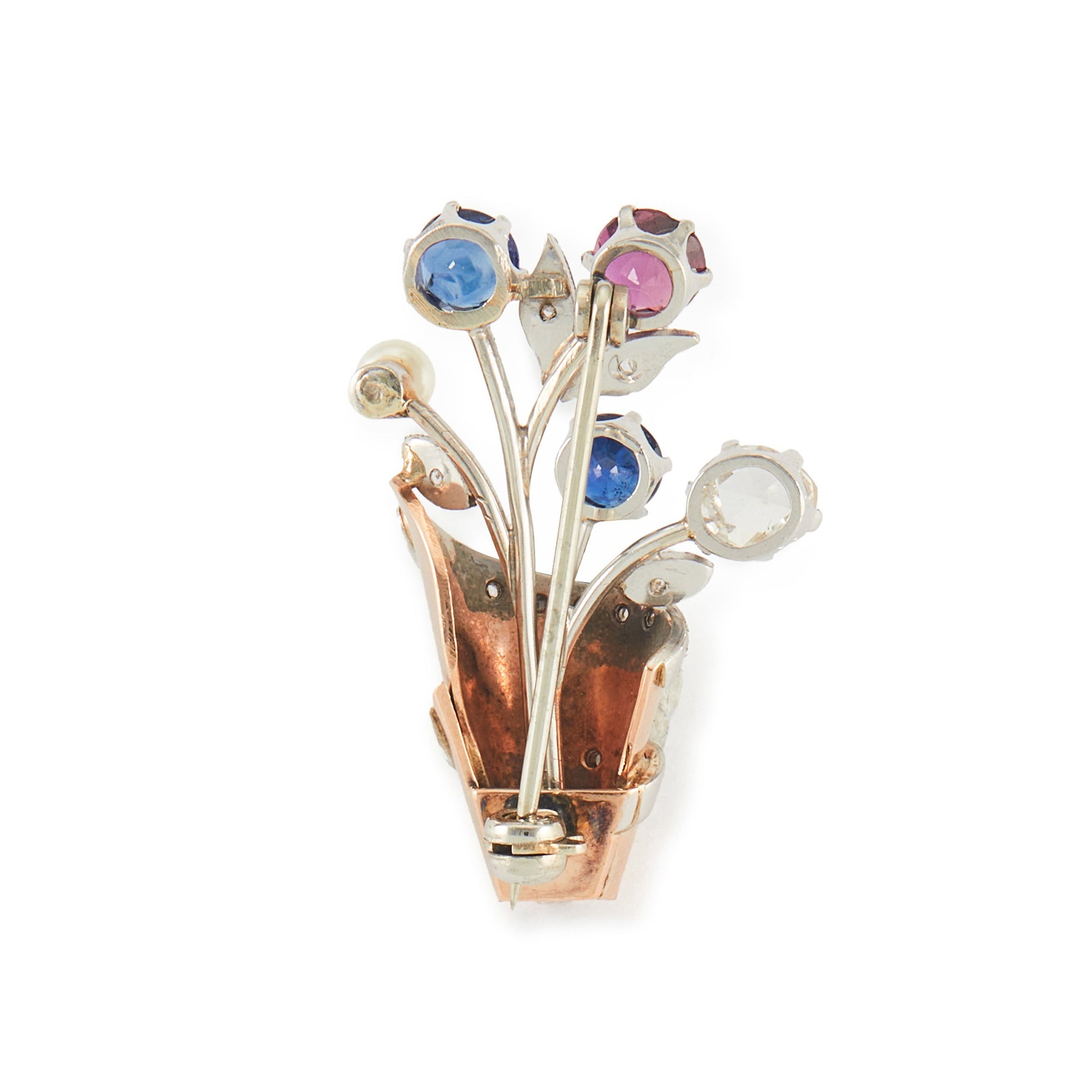 Exquisite 1920s platinum and rose gold brooch set with a deep-red ruby, two sapphires, a natural rose-cut diamond and a pearl. The brooch is also encrusted with eleven small, mine cut diamonds.
